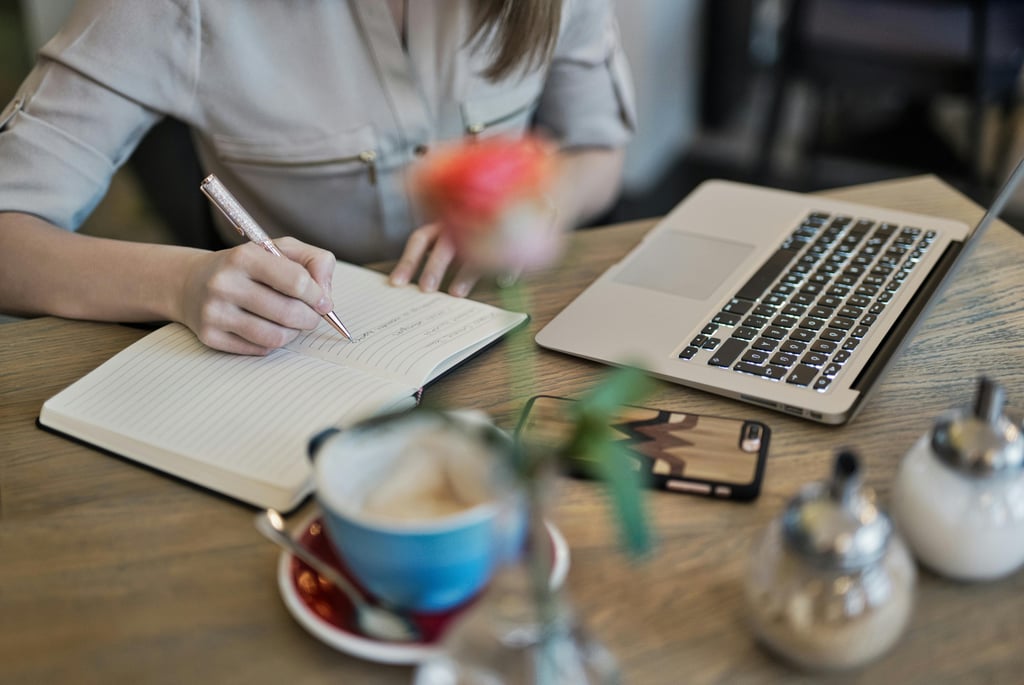 Image of a woman learning by making notes