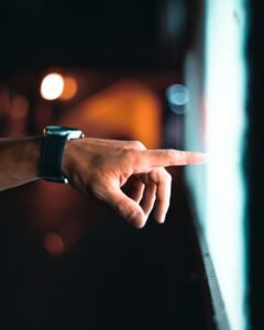 finger pointing at a screen